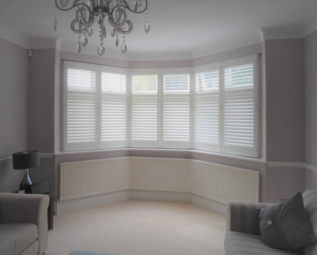 large bay window in lounge with shutters