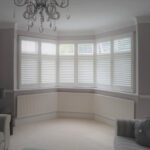 large bay window in lounge with shutters