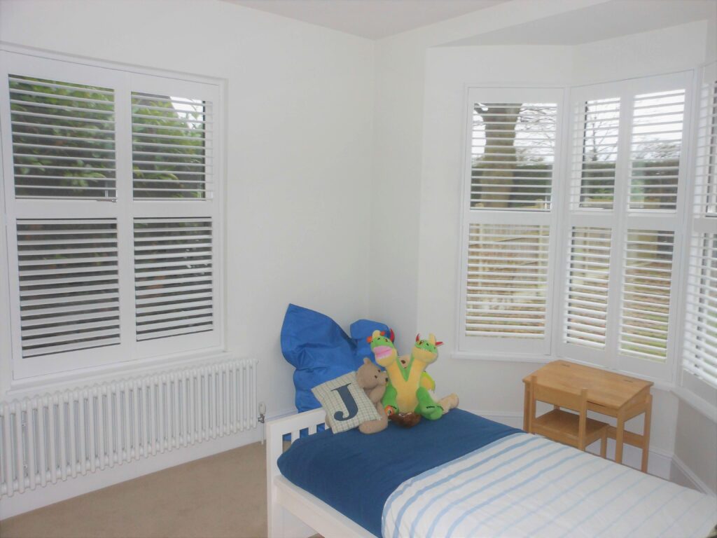 Kids bedroom with two window shutters