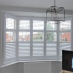 Lounge window with white shutters open