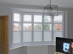 Lounge window with white shutters open