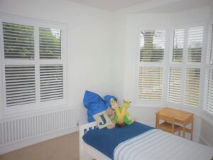 children's bedroom with white shutters