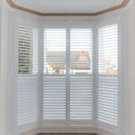 Large 4-panel white bay window shutter