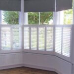 white bay window cafe shutters