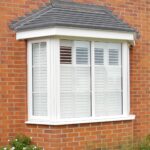 Outside view of a bay window with shutters