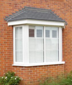 Outside view of a bay window with shutters