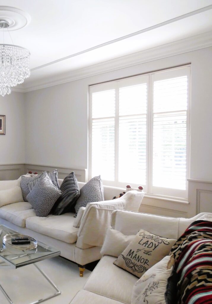 Three panel white shutters in Studley home